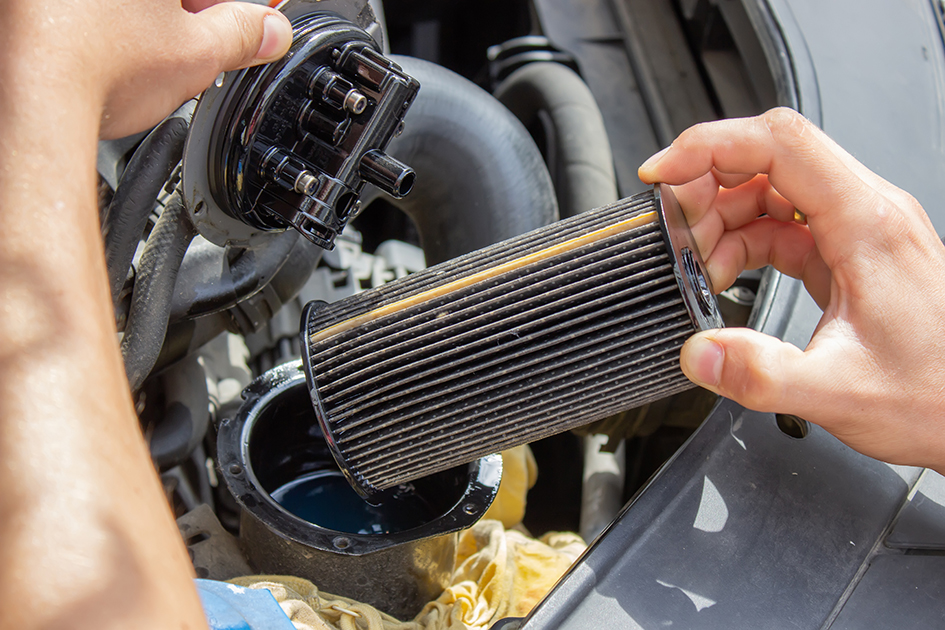 Technician changes car filter, car spare part. Car service concept. selective focus